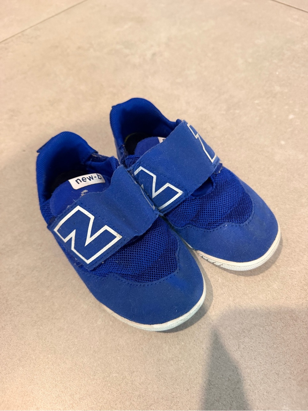 New Balance Kids' boys 9 us size Blue Velcro Slip-On Sneakers
WITH BOX